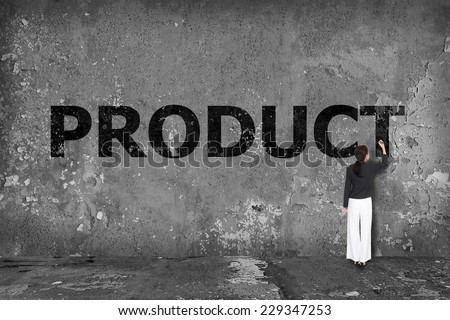 businesswoman drawing product on the wall