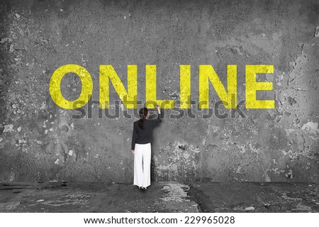 businesswoman drawing online on the wall