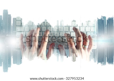 hand with keyboard and city