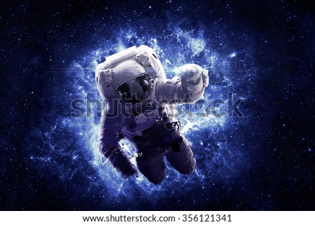 Astronaut Floating Through Space - Elements of this Image Furnished by NASA