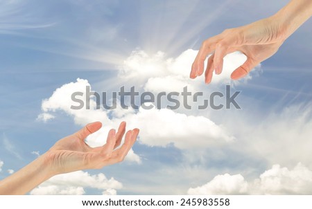 Helping hand reaches for your hand on a background cloudy sky
