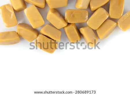 Texture of the caramel toffee on white background. design element