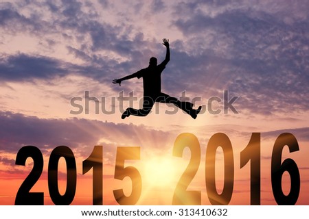 Concept of the new year. A man in a jump between 2015 and 2016 years