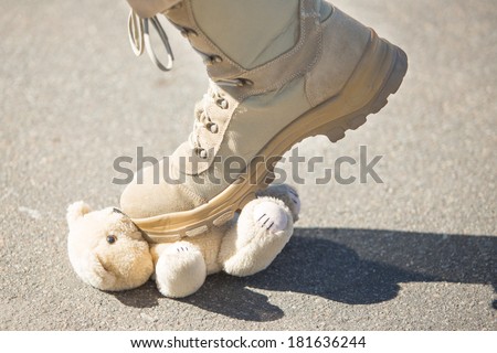 Military man set foot on a toy. concept