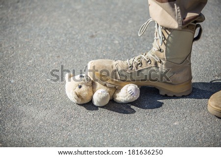 Military man set foot on a toy. concept