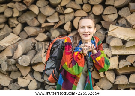 portrait of adventure woman relaxing after walking tour