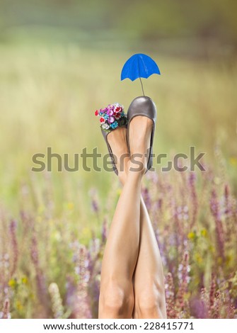 Sexy woman legs in funny shoes. Shoe care concept