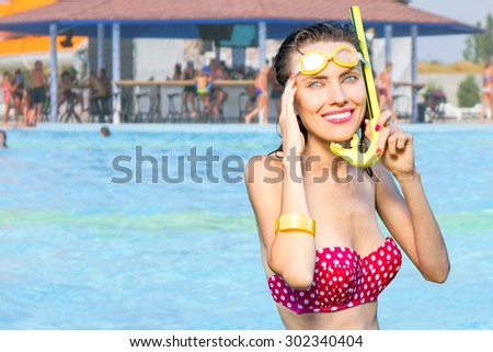 Travel woman on beach vacation with snorkeling mask  enjoying  her summer holiday. Snorkeling, snorkel, summer concept