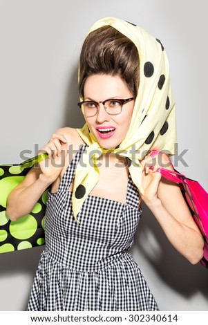 Sexy shopping woman wearing glasses and over grey background. Emotions