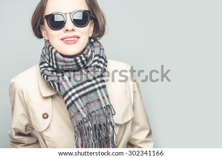 Autumn woman wearing scarf and sunglasses. toned vintage image
