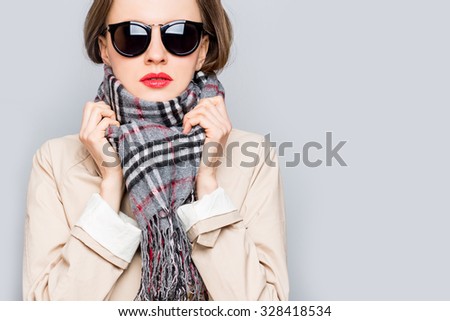 Autumn woman wearing scarf. studio shot