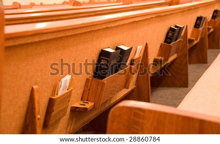 Holy Bible in the back of a pew in a sanctuary