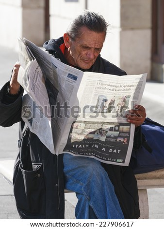 ROME, ITALY - OCTOBER 30, 2014: Reading of the latest news in Rome, Italy.