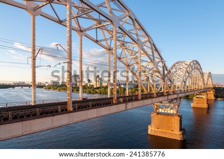 Metal arch bridge for cars and trains. Metal bridge across the river.metal bridge for cars and trains