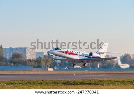 Airplane takes off at airport. Business Jet on the runway