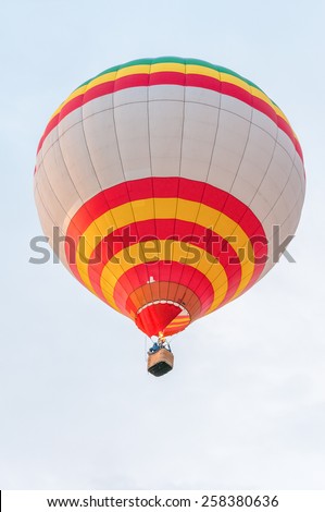White Red Yellow Hot Air Balloons in Flight. Outdoor, Colorful / Colorful hot air balloon in blue sky. White Red Yellow  aerostat