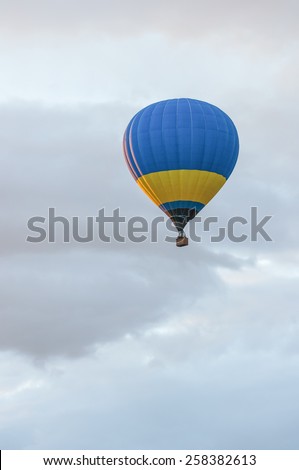 Blue and yellow Hot Air Balloons in Flight. Outdoor, Colorful / Colorful hot air balloon in blue sky. Blue and yellow aerostat