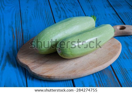 Vegetable marrows on vintage blue wood table from above