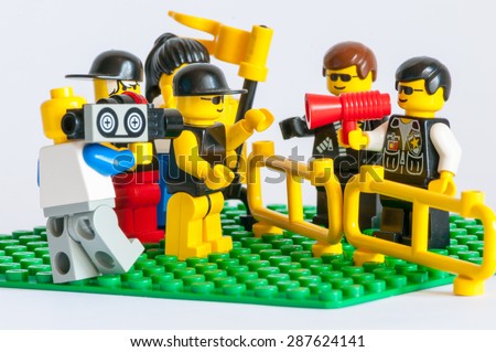 KIEV, UKRAINE - JUNE 14, 2015: Studio shot of Lego minifigure police officer on riot. Legos are a popular line of plastic construction toys manufactured by The Lego Group, a company based in Denmark.