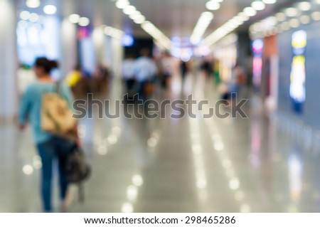 Blur background : Passenger waiting for flight at airport terminal blur background with bokeh light.