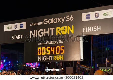 KIEV, UKRAINE - JULY 26, 2015: Illuminated indicator board of Start and finish of Night Run event. July 26, 2015 in Kiev, Ukraine