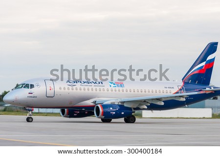 KIEV, UKRAINE - JULY 10, 2015: Aeroflot  SSJ 195-b taxis to teminal at KBP Airport on January 12, 2014. Aeroflot is the flag carrier and largest airline of the Russian Federation