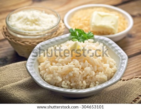 Cooked rice with butter and grated parmesan