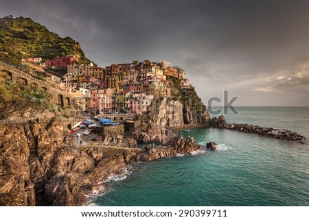 Manarola, Liguria, Italy. The wonderful Manarola village as you can see it from the mountain above. Stormy sky.