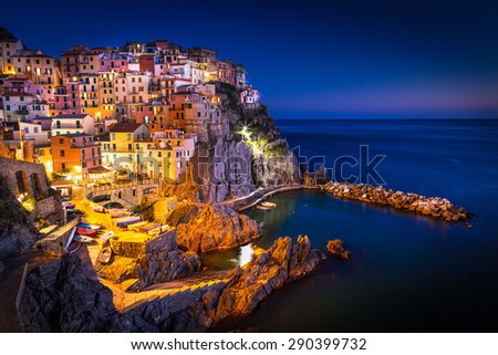 Manarola, Liguria, Italy. The wonderful Manarola village as you can see it from the mountain above. Quiet sky and peaceful sea.