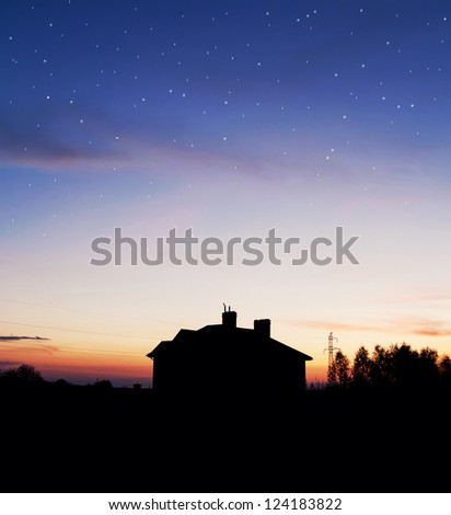 House silhouette with gorgeous sunset sky and stars background
