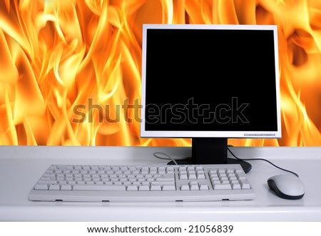 PC with black desktop and fir flames background