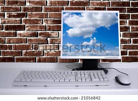 PC with black desktop and brick wall background and sky desktop