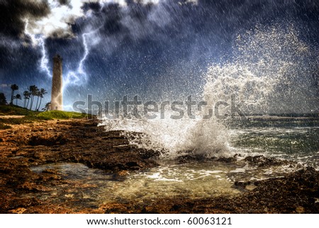 Storm wave lightning weather rain coast tropical island. Large wave crashing into rocky coast as rain pours down, lightning striking Barber\'s Point Lighthouse in the distance, Oahu Hawaii.