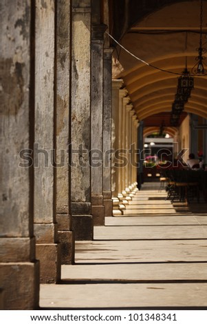 GRANADA, NICARAGUA: Spanish colonial style enclosed corridor with arched columns