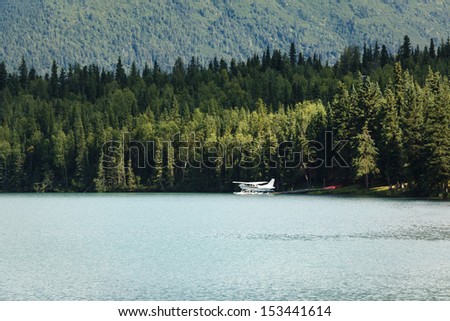 Float plane on glacial lake in Alaska in summer