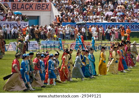 ULAN BATOR, MONGOLIA - JULY 11: Stadium and performers in traditional ethnic Mongolian dress during the opening ceremonies of the Nadaam National Games. July 11, 2008 Ulan Bator, Mongolia