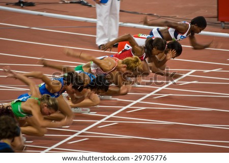 BEIJING - AUG 18: Athletes take off as the women\'s 100 meter sprint begins at the Summer Olympic Games.  Birds Nest Stadium August 18, 2008 Beijing, China