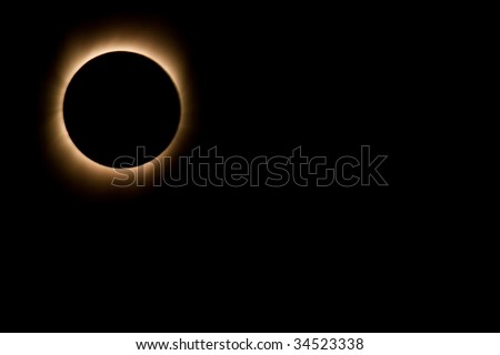Varanasi, India - July 22, 2009: Black disk of full solar eclipse as seen from the banks of the Ganges River