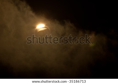 Varanasi, India - July 22, 2009: Diamond Ring effect of full solar eclipse seen through clouds from the banks of the Ganges River July 22, 2009 in Varanasi, India.
