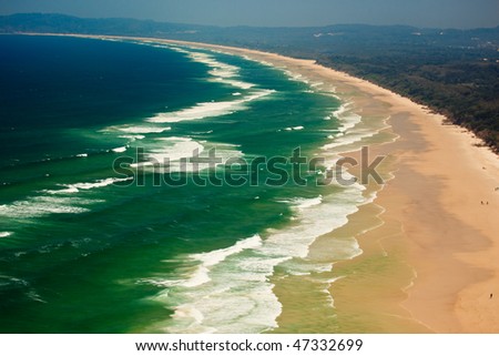 Series of Waves Roll onto Byron Bay Beach in New South Wales, AU