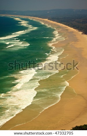 Surf and Waves Roll onto Byron Bay Beach in New South Wales, AU