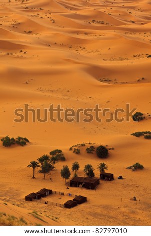Sahara, Morocco: Aerial view of Sahara desert sand dunes and Bedouin camp, Morocco