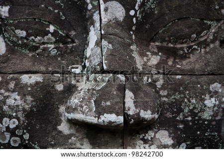 SIEM REAP, CAMBODIA: Detail of face sculpture at the Buddhist temple Prasat Bayon.