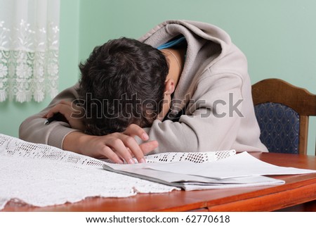tired student sleeping on the table, uninterested in learning