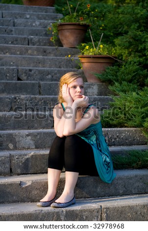 Girl waiting for someone on stairs