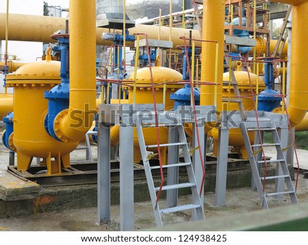 Natural gas station with yellow pipes at power plant