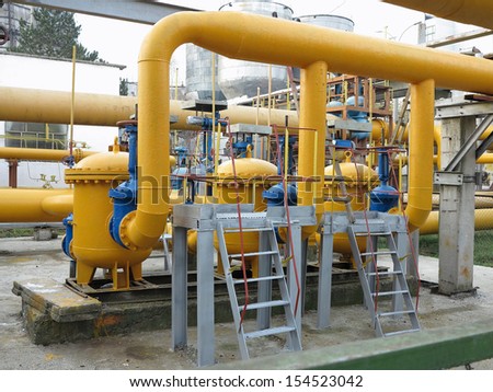 Natural gas station with yellow pipes at power plant