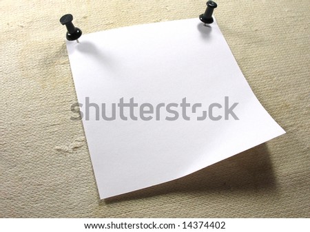 White piece of notice paper over a old canvas background