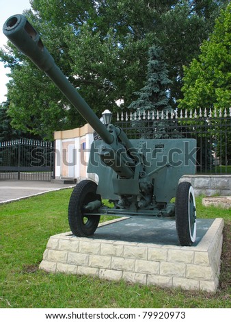 Old anti-tank cannon gun monument on postament