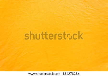 crumpled yellow monk robe. Background